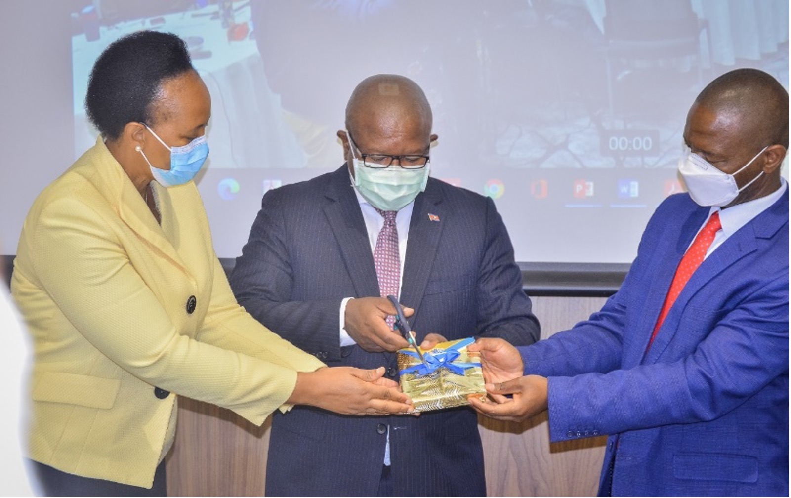 Official Launch of the Eswatini National Pharmacovigilance Policy and Implementation Framework by the Honourable Minister of Commerce Industry and Trade, Manqoba Khumalo (centre), Principal Secretary Dr Simon Zwane  (right), and Deputy Director Pharmaceutical Services, Fortunate Bhembe (left).