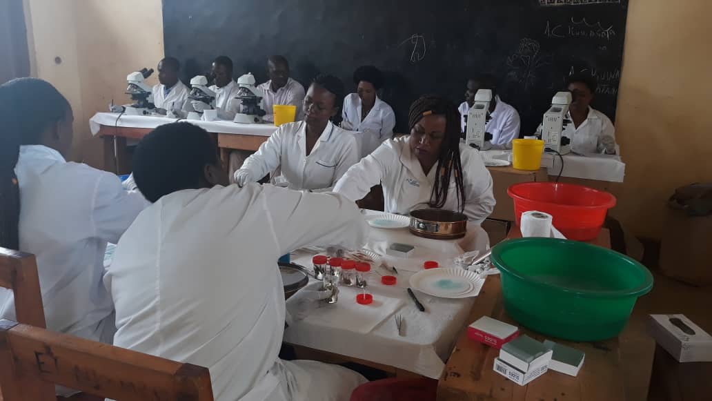 PROFORMA lab techs screening for schistosomiasis. Photo: PROFORMA